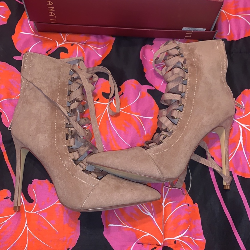 Sexy tie up medium heighten heel. Fault brand new, worn once.